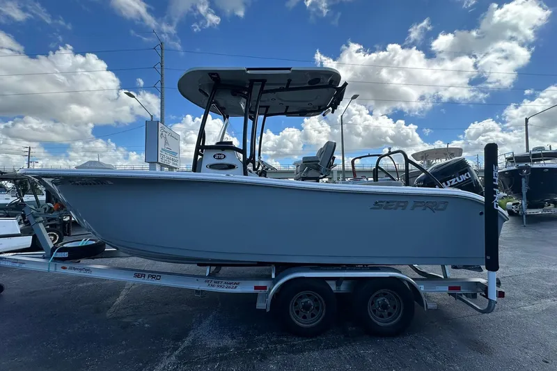 Slide: The Image of 2023 Sea Pro 219 Deep V CC boat on trailer under cloudy sky. - 10