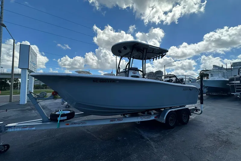 Slide: The Image of 2023 Sea Pro 219 Deep V CC boat on trailer under cloudy sky. - 11