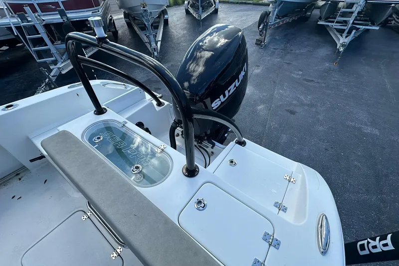 Slide: The Image of 2023 Sea Pro 219 Deep V CC boat with Suzuki outboard motor, docked on a trailer. - 15