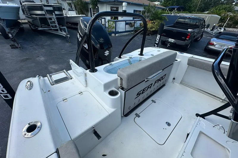 Slide: The Image of 2023 Sea Pro 219 Deep V CC boat interior with seating and storage compartments. - 18