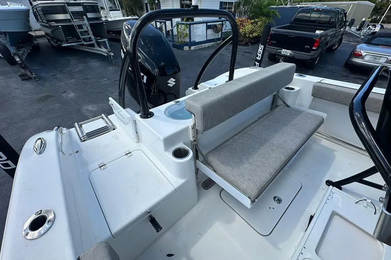 Slide: The Image of 2023 Sea Pro 219 Deep V CC boat interior with seating and storage compartments. - 19