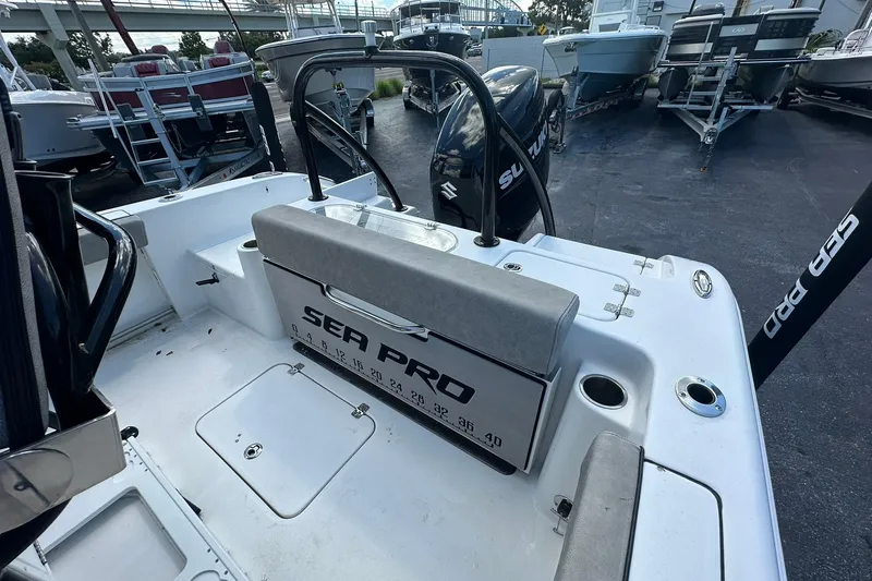 Slide: The Image of 2023 Sea Pro 219 Deep V CC boat interior with seating and storage compartments. - 21