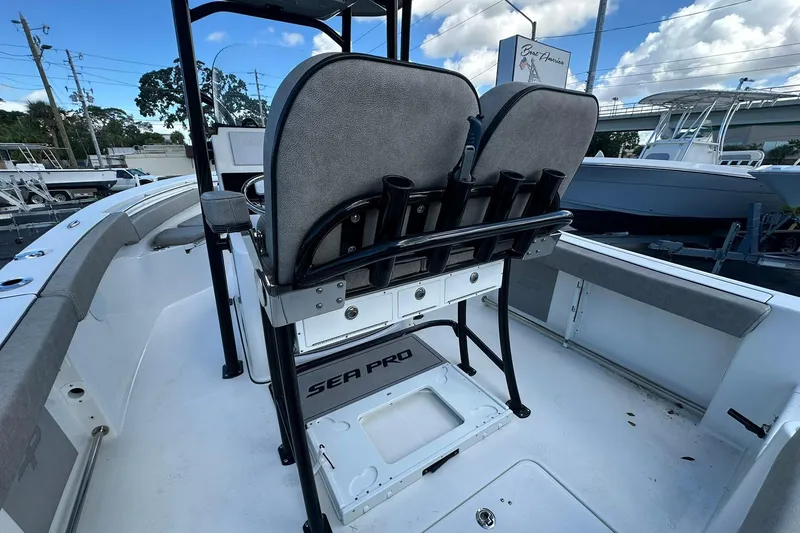 Slide: The Image of 2023 Sea Pro 219 Deep V CC boat interior with seating and rod holders. - 22
