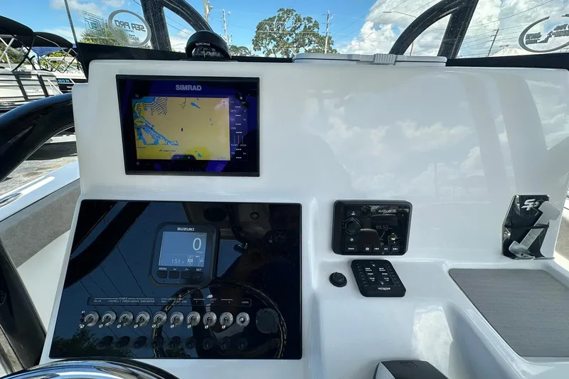 Slide: The Image of 2023 Sea Pro 219 Deep V CC boat dashboard with navigation and control systems. - 25