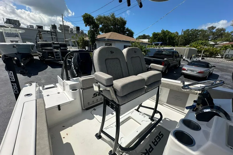 Slide: The Image of 2023 Sea Pro 219 Deep V CC boat interior with dual seats and steering console. - 28