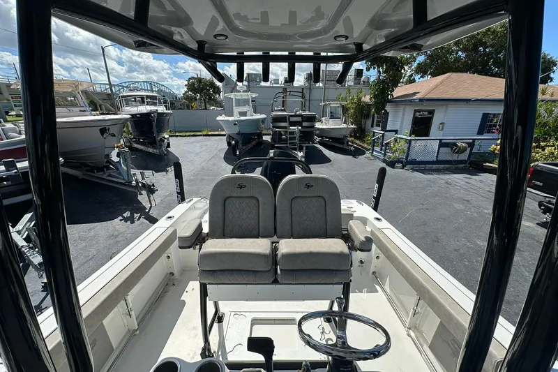 Slide: The Image of 2023 Sea Pro 219 Deep V CC boat interior with dual seats and steering wheel. - 29