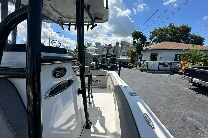 Slide: The Image of 2023 Sea Pro 219 Deep V CC boat in a sunny outdoor setting. - 31
