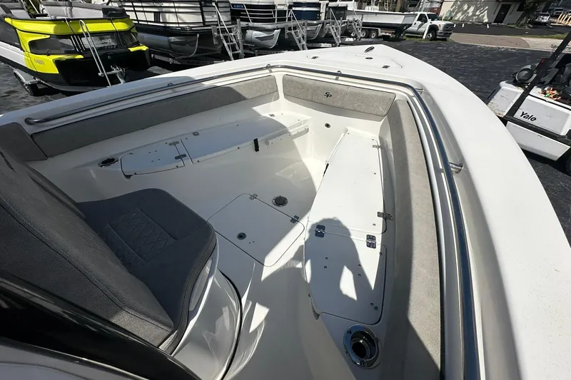 Slide: The Image of 2023 Sea Pro 219 Deep V CC boat interior with seating and storage compartments. - 34
