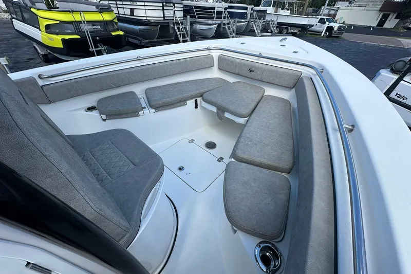 Slide: The Image of 2023 Sea Pro 219 Deep V CC boat interior with cushioned seating and sleek design. - 38