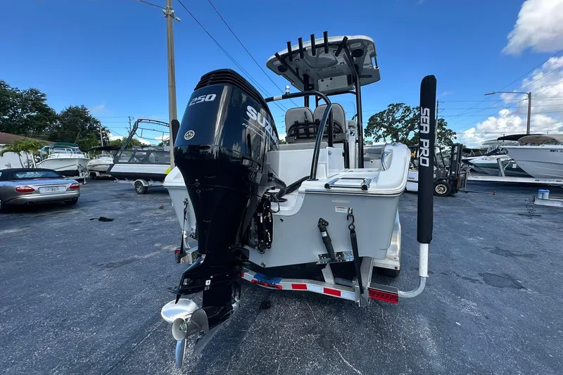 Slide: The Image of 2023 Sea Pro 219 Deep V CC boat with powerful outboard motor, parked on trailer. - 6