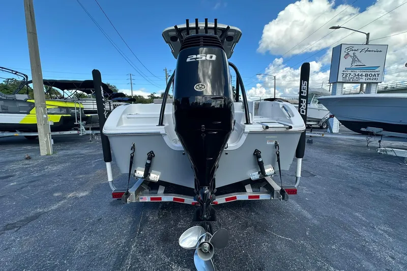 Slide: The Image of 2023 Sea Pro 219 Deep V CC boat with powerful 250 engine, displayed outdoors. - 7