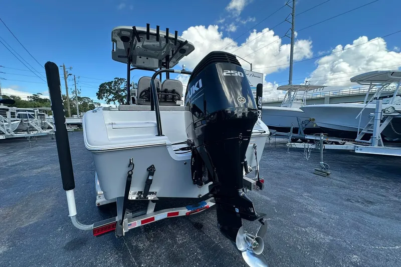 Slide: The Image of 2023 Sea Pro 219 Deep V CC boat with Suzuki 250 outboard motor in a marina. - 8