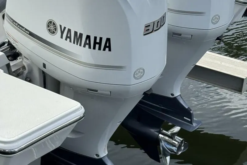 Slide: The Image of Twin Yamaha 300 outboard engines on a 2020 Pursuit S 328 Sport boat. - 21