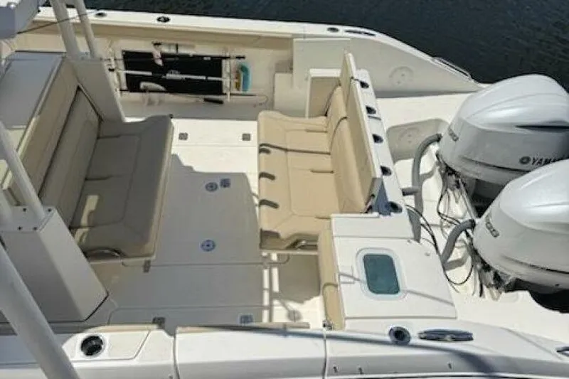 Slide: The Image of 2020 Pursuit S 328 Sport boat interior with seating and dual Yamaha engines. - 4