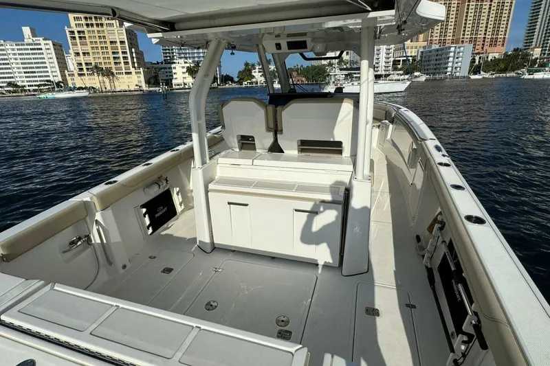 Slide: The Image of 2020 Pursuit S 328 Sport boat interior with city skyline in background. - 9