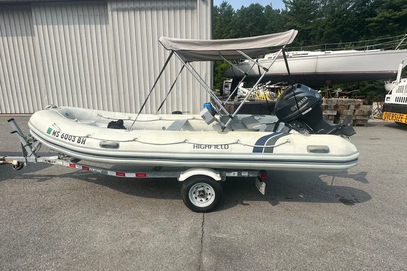 The Image of 2016 Highfield RS-460 inflatable boat on trailer with Yamaha outboard motor. - 0