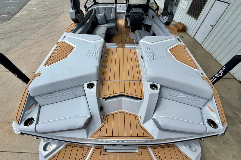 Slide: The Image of 2026 Nautique Super Air Nautique G23 boat interior with sleek seating and modern design. - 10