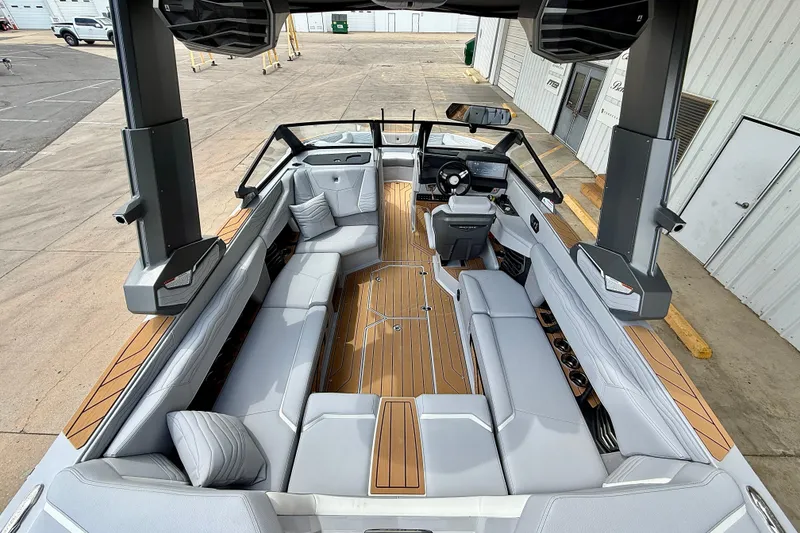 Slide: The Image of 2026 Nautique Super Air Nautique G23 boat interior with sleek seating and modern design. - 11