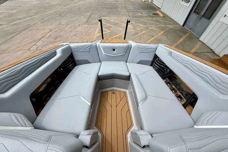 Slide: The Image of 2026 Nautique Super Air Nautique G23 boat interior with luxurious seating and modern design. - 14