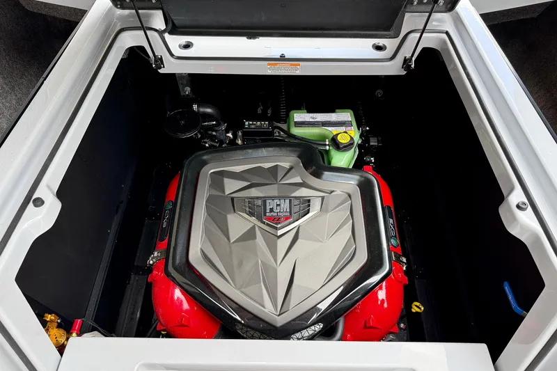 Slide: The Image of 2026 Nautique Super Air Nautique G23 engine compartment with PCM engine cover. - 24