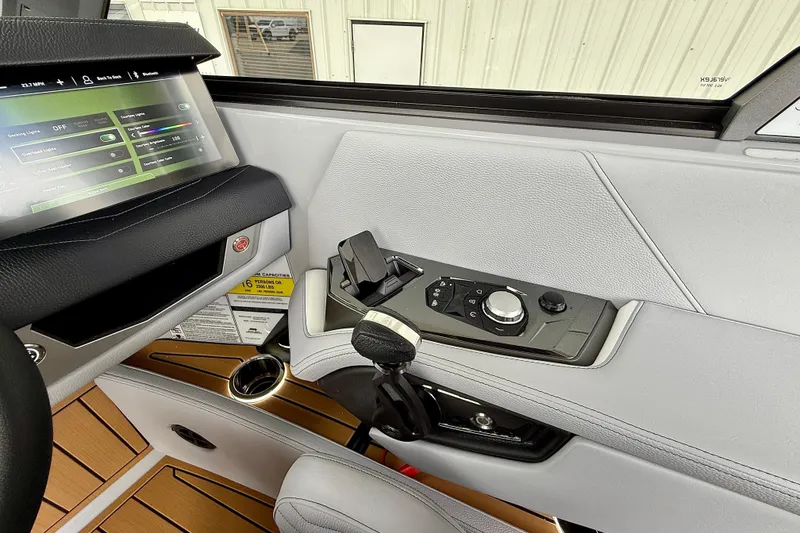 Slide: The Image of 2026 Nautique Super Air Nautique G23 dashboard with touchscreen controls and sleek interior design. - 28