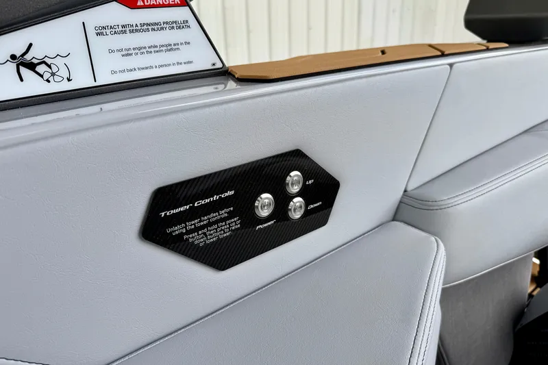 Slide: The Image of 2026 Nautique Super Air Nautique G23 interior with tower controls and safety warning. - 29