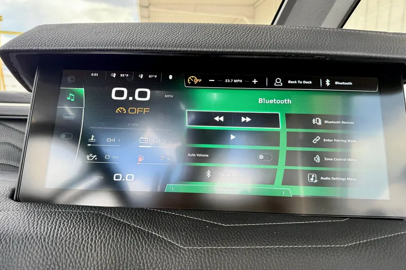 Slide: The Image of 2026 Nautique Super Air Nautique G23 dashboard display with Bluetooth and control settings. - 31