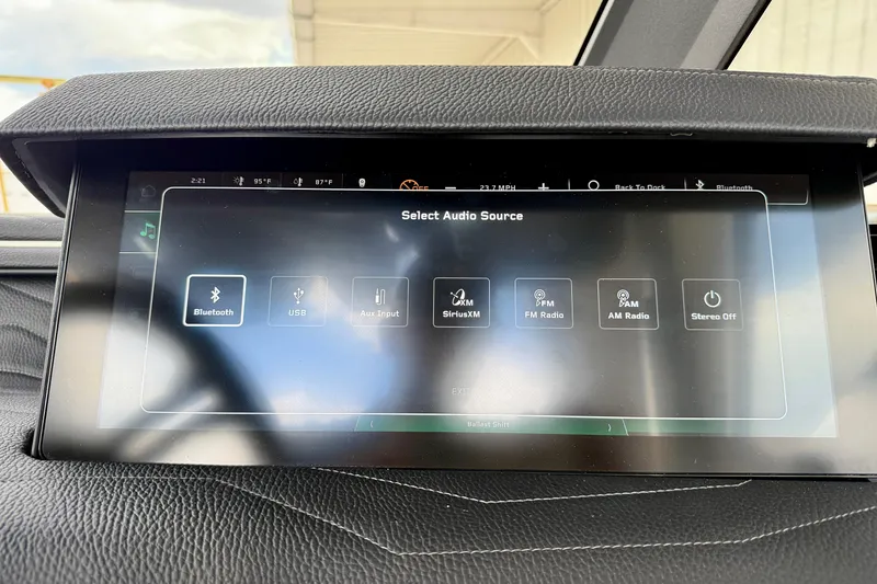 Slide: The Image of Touchscreen audio source selection in 2026 Nautique Super Air Nautique G23 boat. - 32