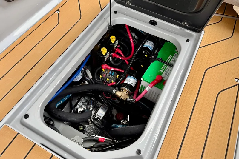 Slide: The Image of 2026 Nautique Super Air Nautique G23 engine compartment with visible wiring and components. - 39