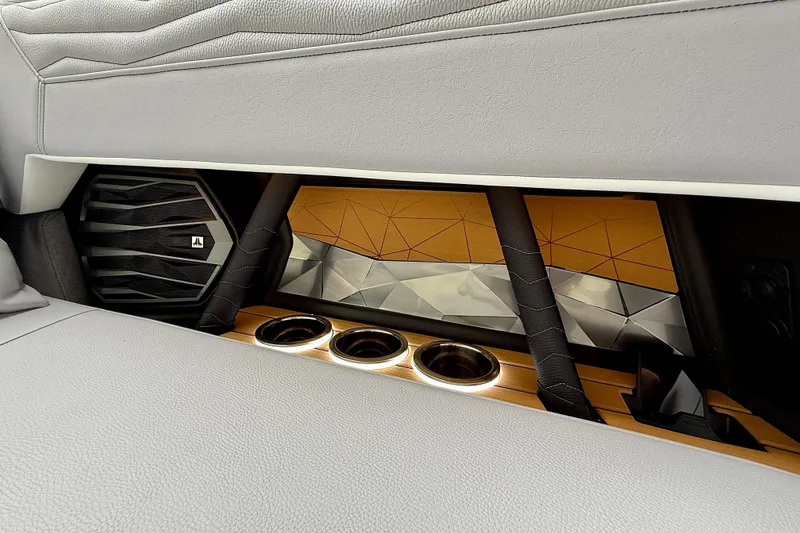 Slide: The Image of 2026 Nautique Super Air Nautique G23 interior with speaker and cup holders. - 40