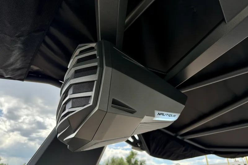 Slide: The Image of 2026 Nautique Super Air Nautique G23 speaker detail under boat canopy. - 44