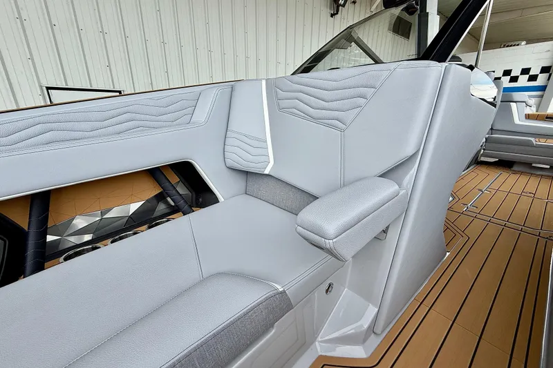 Slide: The Image of 2026 Nautique Super Air Nautique G23 interior with sleek gray seating and modern design. - 46