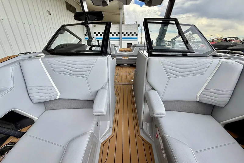 Slide: The Image of 2026 Nautique Super Air Nautique G23 interior with sleek gray seating and modern design. - 47