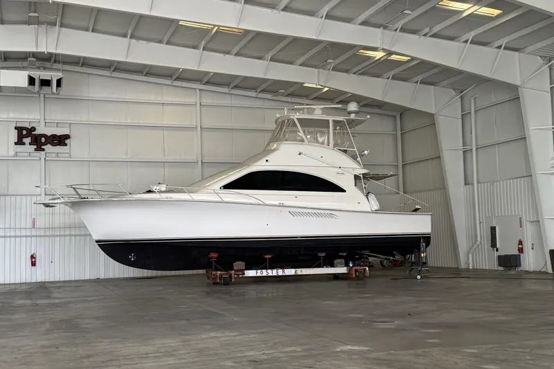 The Image of 2005 Fifth Ocean Yachts 46 SS in a spacious indoor storage facility. - 1