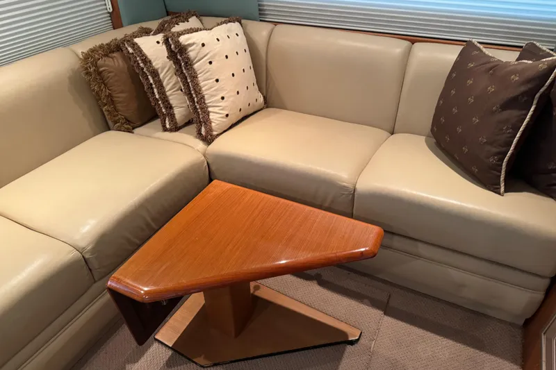 Slide: The Image of Luxurious interior of 2005 Fifth Ocean Yachts 46 SS with beige sofa and decorative pillows. - 7