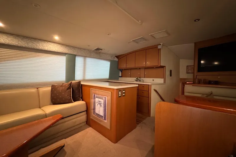 Slide: The Image of Luxurious interior of 2005 Fifth Ocean Yachts 46 SS with cozy seating and modern amenities. - 8