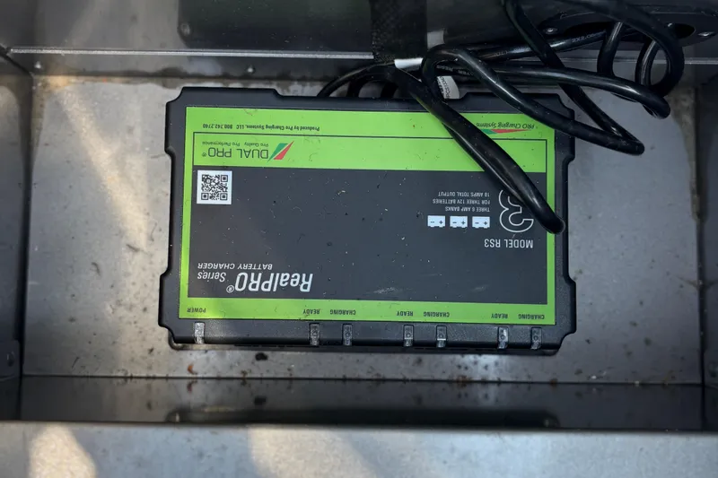 Slide: The Image of Battery charger in a 2020 Lund 1775 Adventure SS boat compartment. - 14