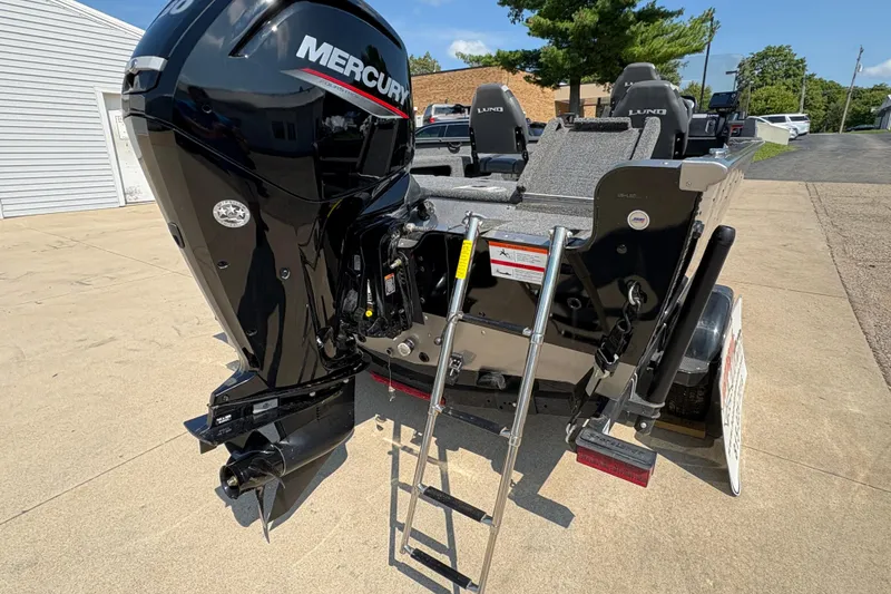Slide: The Image of 2020 Lund 1775 Adventure SS boat with Mercury outboard motor and ladder on trailer. - 24