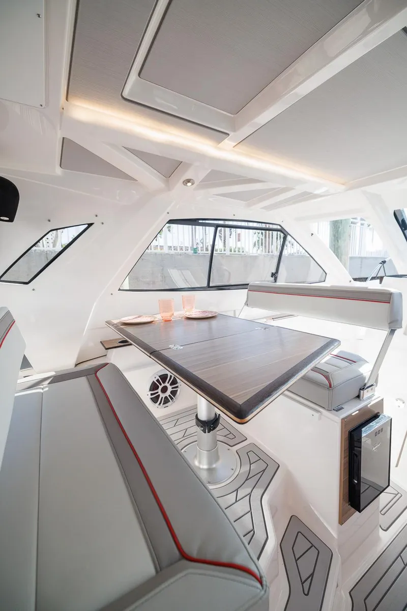 Slide: The Image of Interior of 2026 Solara S-310 SB boat with modern seating and dining area. - 34