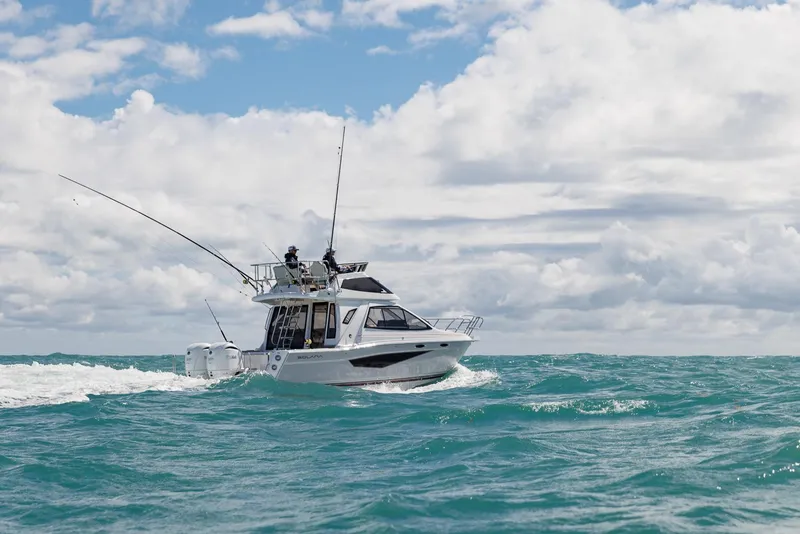 Slide: The Image of 2026 Solara S-310 SB boat cruising on open sea under cloudy sky. - 4