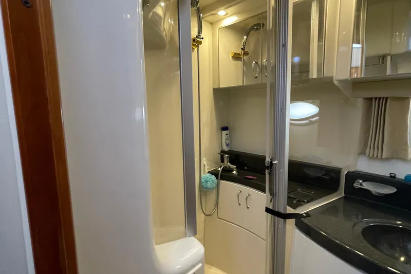 Slide: The Image of Interior of 2003 Carver 36 Sport Sedan bathroom with shower and sink. - 18