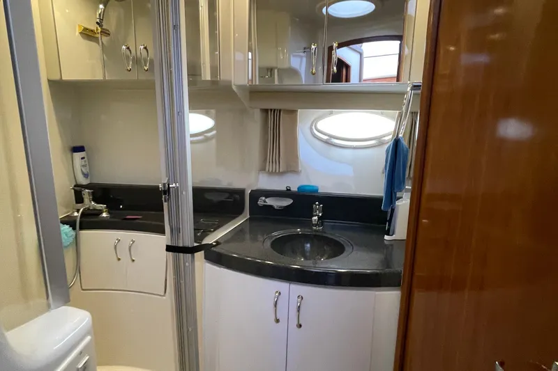 Slide: The Image of Luxurious bathroom in 2003 Carver 36 Sport Sedan yacht with modern fixtures and oval window. - 21