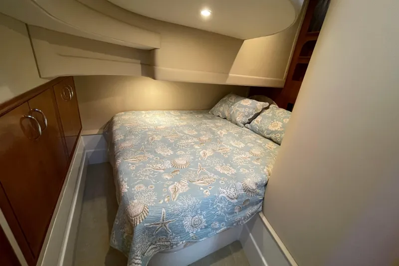 Slide: The Image of Cozy bedroom in 2003 Carver 36 Sport Sedan with nautical-themed bedding. - 23