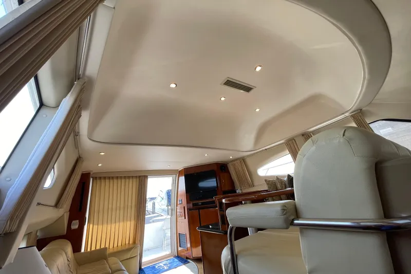 Slide: The Image of Interior of 2003 Carver 36 Sport Sedan yacht, featuring luxurious seating and modern design. - 27