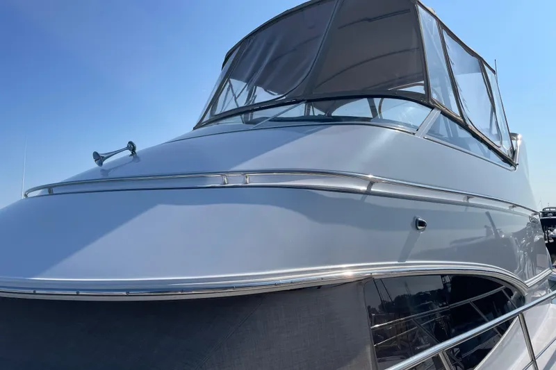 Slide: The Image of 2003 Carver 36 Sport Sedan yacht with sleek design and tinted windows. - 3