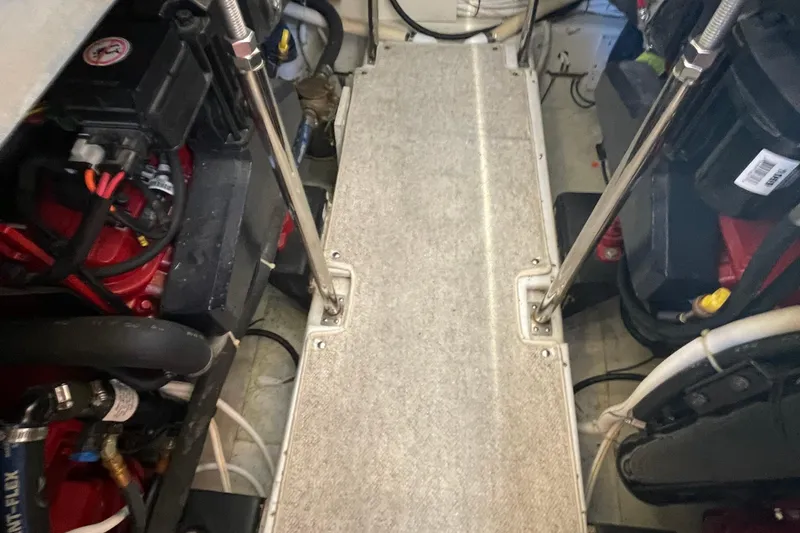 Slide: The Image of Engine room of a 2003 Carver 36 Sport Sedan with visible components and wiring. - 32