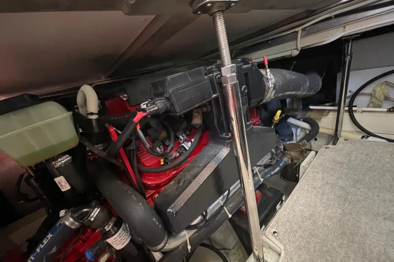 Slide: The Image of Engine compartment of a 2003 Carver 36 Sport Sedan boat, showcasing mechanical components. - 33