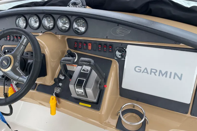 Slide: The Image of 2003 Carver 36 Sport Sedan dashboard with Garmin navigation system and control panel. - 40