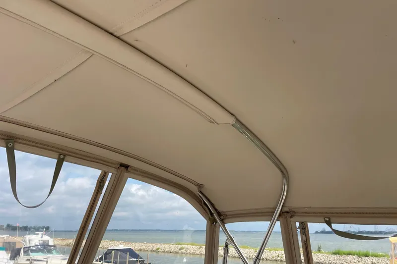 Slide: The Image of Interior view of 2003 Carver 36 Sport Sedan boat with lake and sky background. - 42