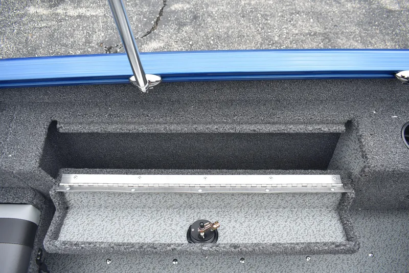 Slide: The Image of Interior view of 2026 Lund 1775 Adventure Sport boat, featuring storage compartment. - 11